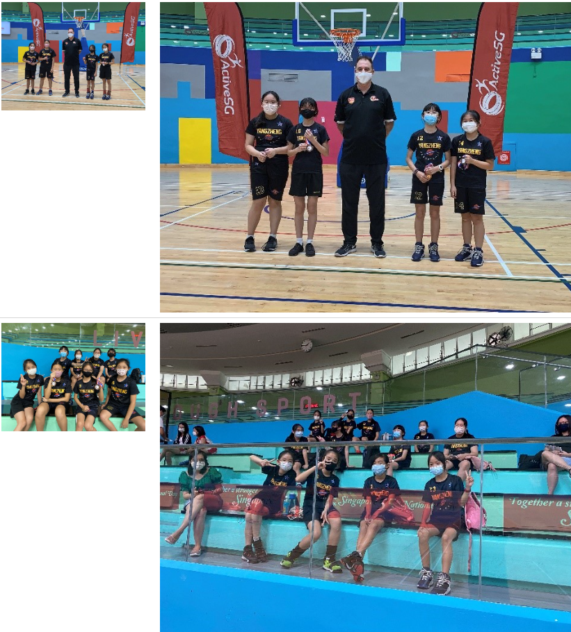 A group of primary school girls basketball players posing at a basketball court with their teachers